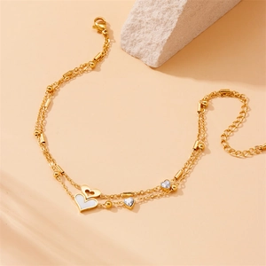 Golden double-layer anklet with white heart pendant and sparkling tree of life charms