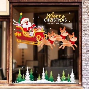 Christmas window stickers featuring Santa Claus and reindeer over a snowy forest landscape