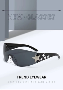 Detail of black wraparound sunglasses featuring silver star metal ornaments on the temple