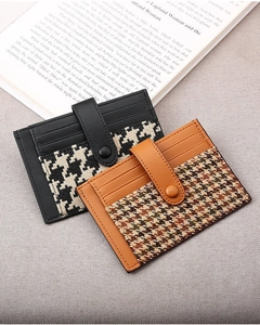 Slim accordion card wallet with houndstooth pattern and snap closure for daily commute