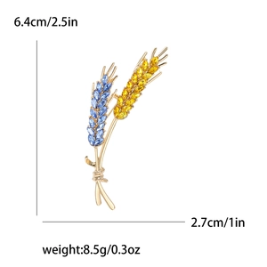 Wheat ear brooch with blue and yellow crystals on gold base, 6.4cm height dimensions