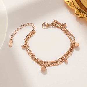 Double-layered 18K rose gold plated stainless steel bracelet with beads and cube charms