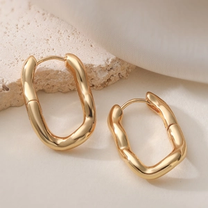 Minimalist gold irregular rectangle hoop earrings with wavy texture on stone base