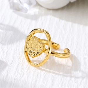 Macro shot of gold-plated stainless steel open ring featuring a raised heart design