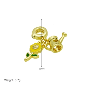 Detail view of 28mm gold sunflower and watering can charms with 3.7g weight info