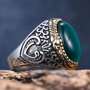 Vintage gold and silver stainless steel ring for men with a large oval green gemstone