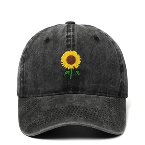 Washed cotton baseball cap in black with embroidered sunflower design for outdoor wear