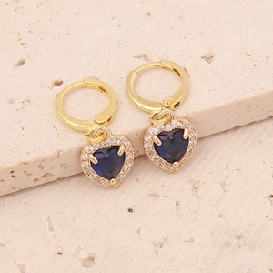 Detail of heart drop earrings with blue zircon and pavé crystals on stone base