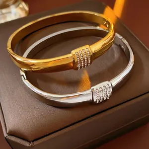 Gold and silver stainless steel bangles with rectangular crystal pavé settings