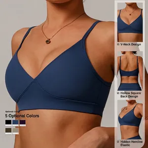 Navy blue V-neck sports bra with thin straps and square open back yoga top design