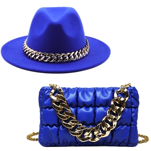 British style electric blue wool fedora hat paired with a matching quilted leather chain bag