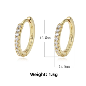 Macro view of 925 sterling silver hoop earrings with clear cubic zirconia pavé setting