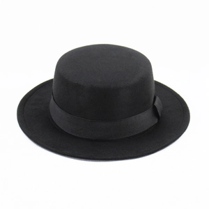 Detailed close-up of a classic black wool felt flat top boater hat with a satin ribbon