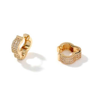 Golden earrings with micro-set zircons and elegant wavy design on a white background