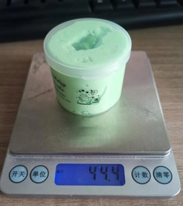 Detailed weight measurement of a 70ml green Birthday Cake scented butter slime jar