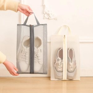 Portable mesh travel shoe bag with handle and zipper in grey and off-white colors