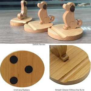 Detail of wooden dog phone holder with anti-slip rubber pads and smooth groove