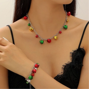 Detail of Christmas jewelry set with colorful bells on silver necklace and bracelet