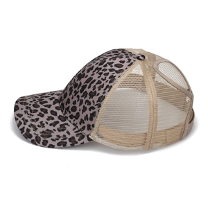 Detail view of leopard print ponytail trucker hat with breathable mesh back and opening