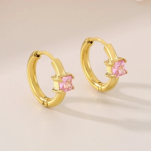 Detail of pink square-cut stones on gold hoop earrings with secure four-prong setting