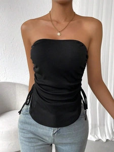 Detailed view of black ribbed knit tube top featuring adjustable side drawstring ties