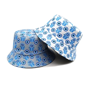 Unisex canvas bucket hats with evil eye and hamsa hand patterns in grey and white