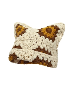 Close-up of handmade crochet knit hat featuring cat ears and textured stitch details