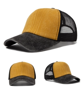 Detail view of mustard yellow canvas front with breathable black mesh and distressed texture