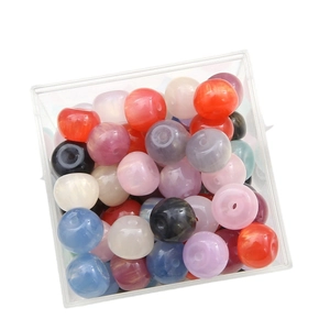 Mix of colorful resin glitter star beads in a square box for DIY jewelry making
