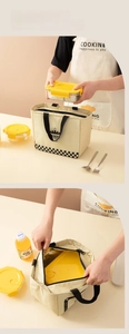 Close-up of insulated lunch bag with checkered pattern and foil lining detail