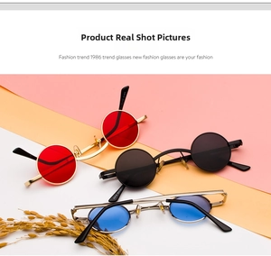 Flat lay of vintage steampunk sunglasses with red black and blue round metal frames