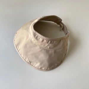 Detail of beige sun visor showing breathable mesh lining and adjustable elastic drawstring