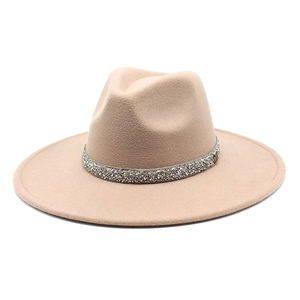 Detail of khaki wide brim fedora hat featuring a sparkling rhinestone decorative band