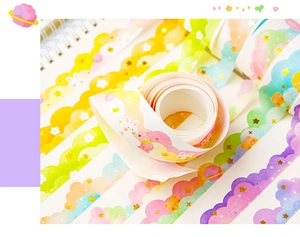 Macro shot of colorful cloud and star patterns on wavy edge washi tapes