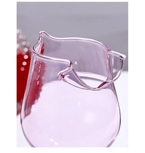 Detail shot of the pink rose glass rim and spout highlighting clear glass texture