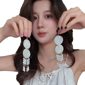 Elegant French style long tassel earrings with shell discs and white pearls on gold-tone metal