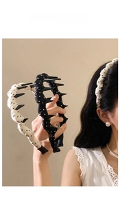 Close-up of non-slip wavy headband with classic polka dot pattern for women