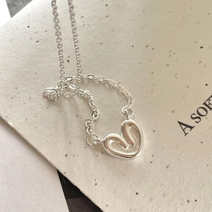 Minimalist 925 sterling silver necklace featuring an abstract heart pendant with flowing lines