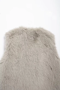 Close-up of the plush gray faux fur texture and material on this elegant sleeveless vest
