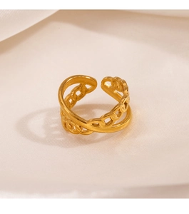 Close-up of 18K gold plated double-layer X cross ring on soft cream satin fabric