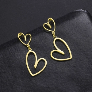 Exaggerated hollow heart design gold drop earrings made of stainless steel for women