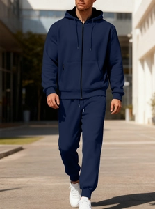 Detail of navy blue fleece tracksuit featuring a zip hooded sweatshirt and matching joggers