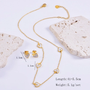 Golden stainless steel jewelry set with leaf and heart charms, including size and weight