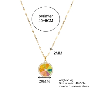 Detail showing a 20mm colorful orange pendant on a gold stainless steel chain