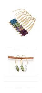 Detailed view of iridescent arrow earrings showing 1.8cm size and 3.5g weight metrics