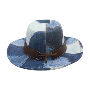 Detail of western cowboy hat featuring blue denim patchwork and brown leather band