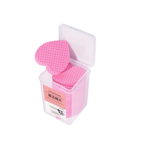 Pink heart-shaped lash glue cleaning pads with mesh texture in a clear storage box