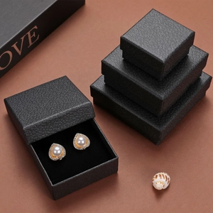 Macro detail of black litchi grain jewelry boxes with soft sponge lining for rings