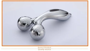 Detailed macro view of the Y-shaped 3D facial massage roller with silver metallic finish