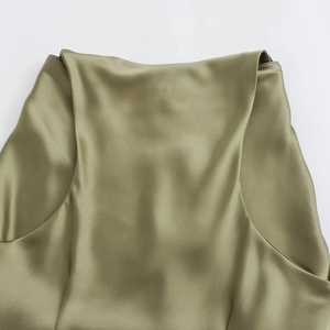 Detailed close-up showing the glossy olive green satin fabric texture and premium sheen